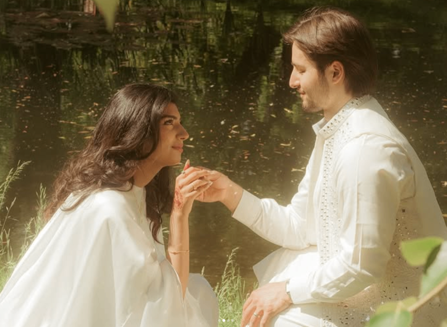 Romantic engagement portrait near the water photographed by Pamila